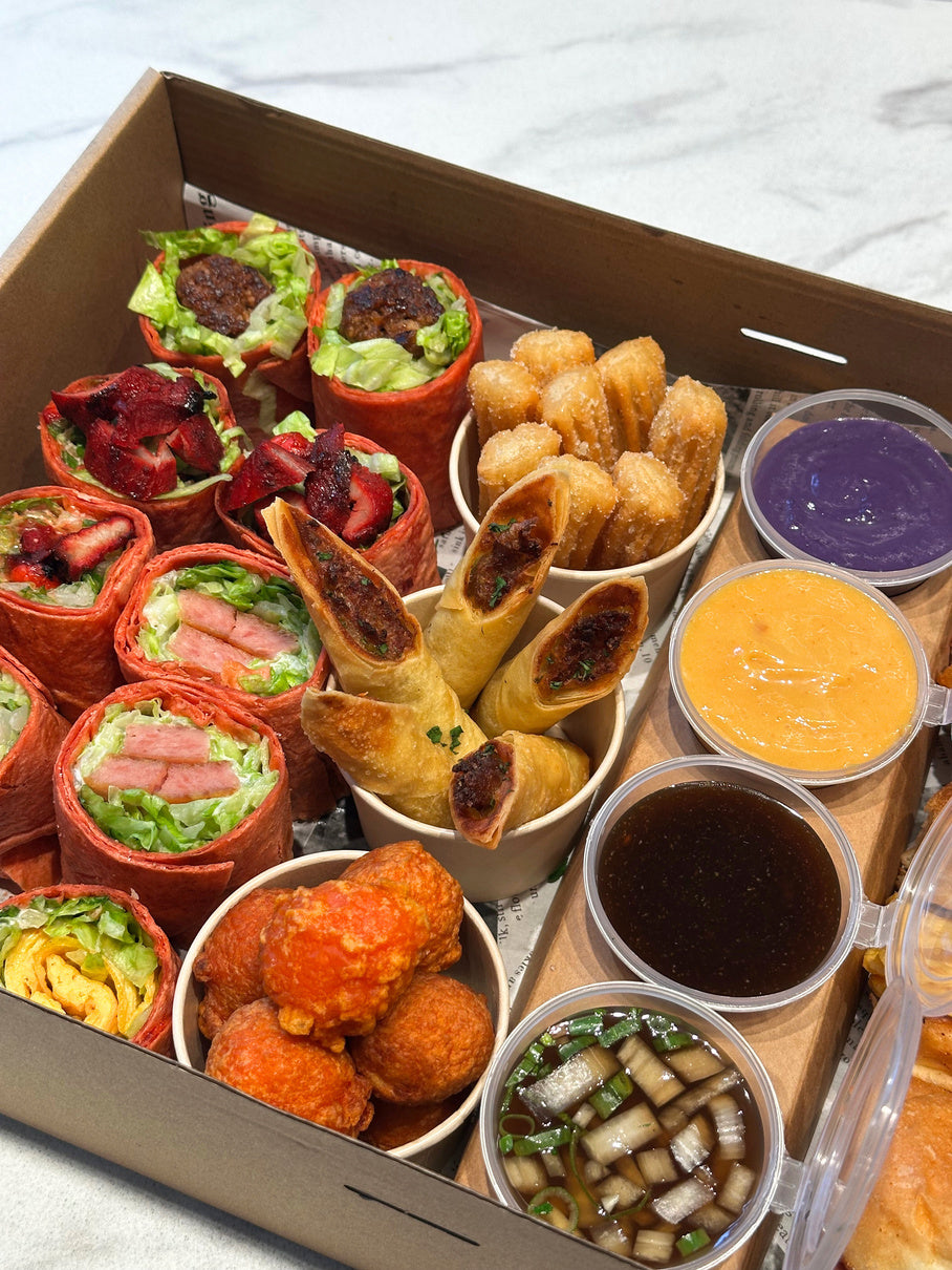 Hanmade’s catering spread with colourful wraps, savoury bites, churros and dessert cups