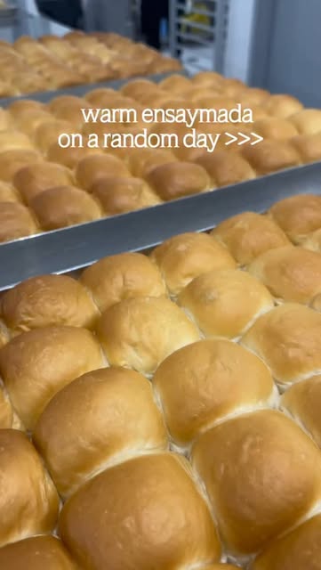 Trays of warm ensaymada buns fresh from the oven