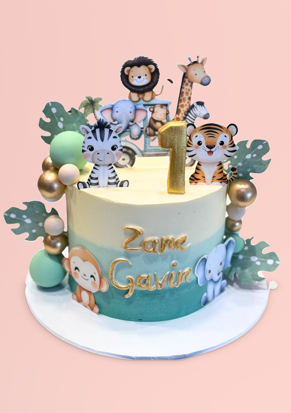 Safari Theme Cake with jungle animal toppers and a gold number 1
